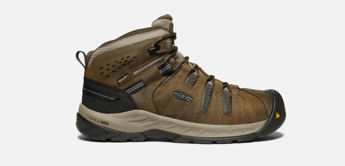 Mens Keen 6 Inch Flint ll steel toe hiker style work boots in Brown. Side view showing single boot.