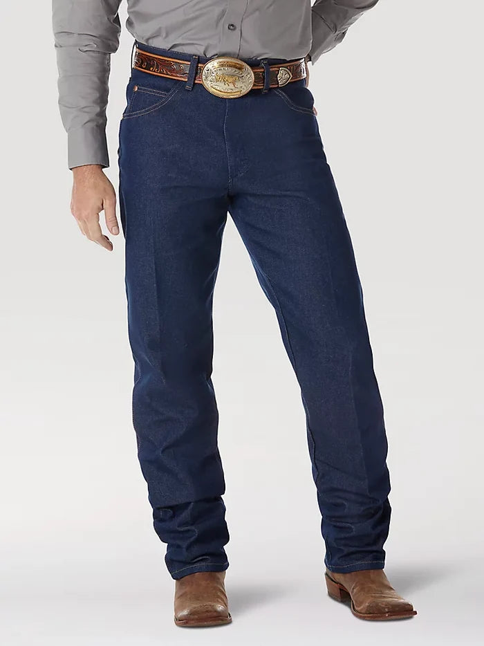 A man wearing Wrangler® Cowboy Cut® rigid relaxed fit blue jeans with western shirt, belt, and boots. Front view.