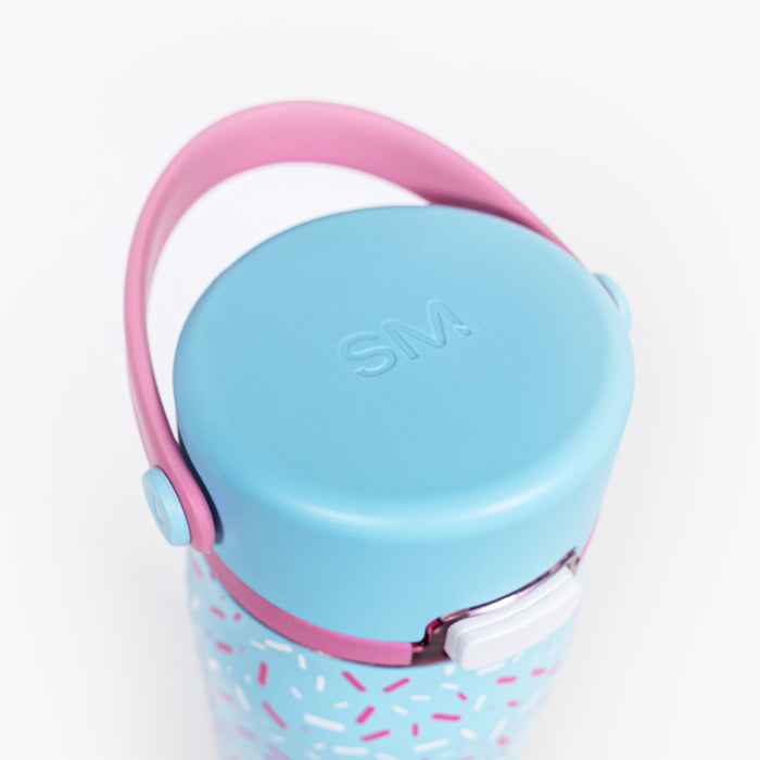 Adult model wearing blue water bottle with "Mesa Sport" design