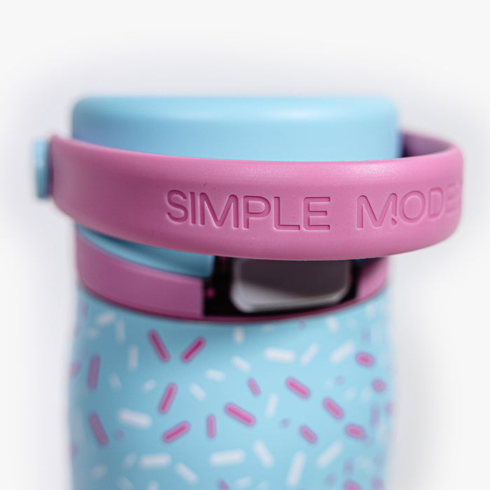 Adult model wearing blue water bottle with "Mesa Sport" design