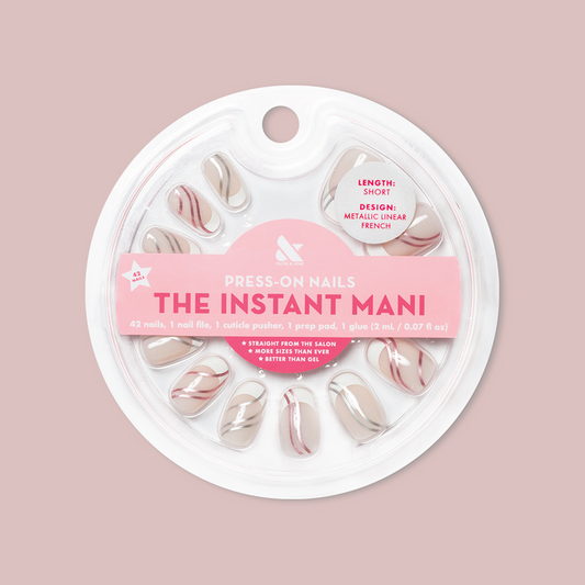 Metallic Linear French - Press-On | Short | Round false nails with metallic linear french design in round shape in packaging on pink background