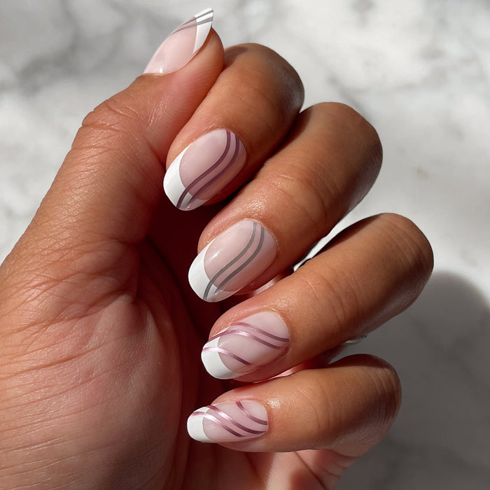 Metallic Linear French - Press-On | Short | Round false nails with white tips and curved metallic lines on neutral base
