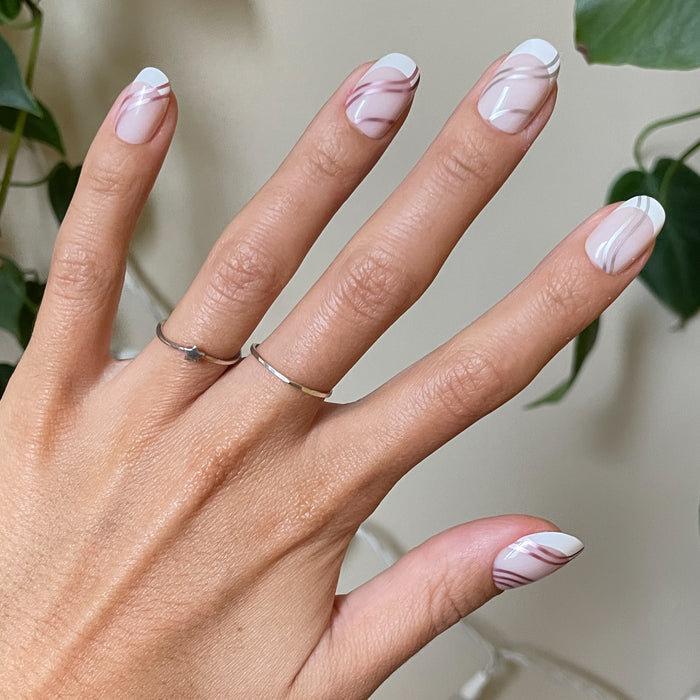 Metallic Linear French - Press-On | Short | Round short false nails with white tips and fine metallic line details on natural nails