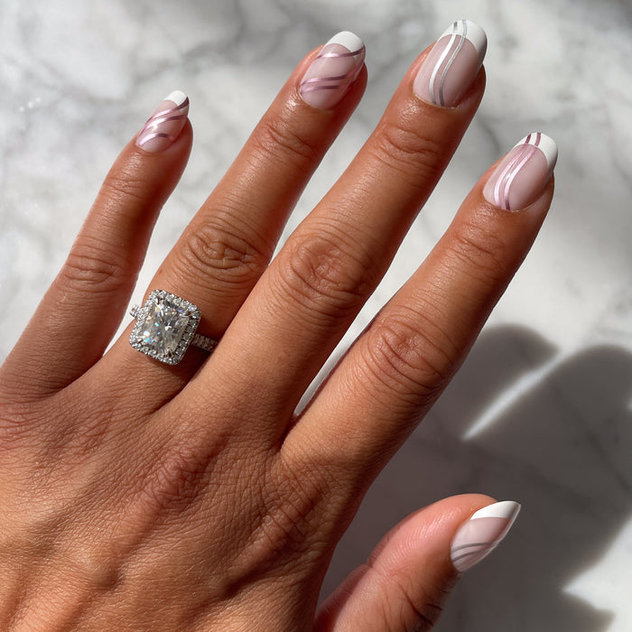 Metallic Linear French - Press-On | Short | Round false nails with white tips and curved metallic lines on natural hand with ring