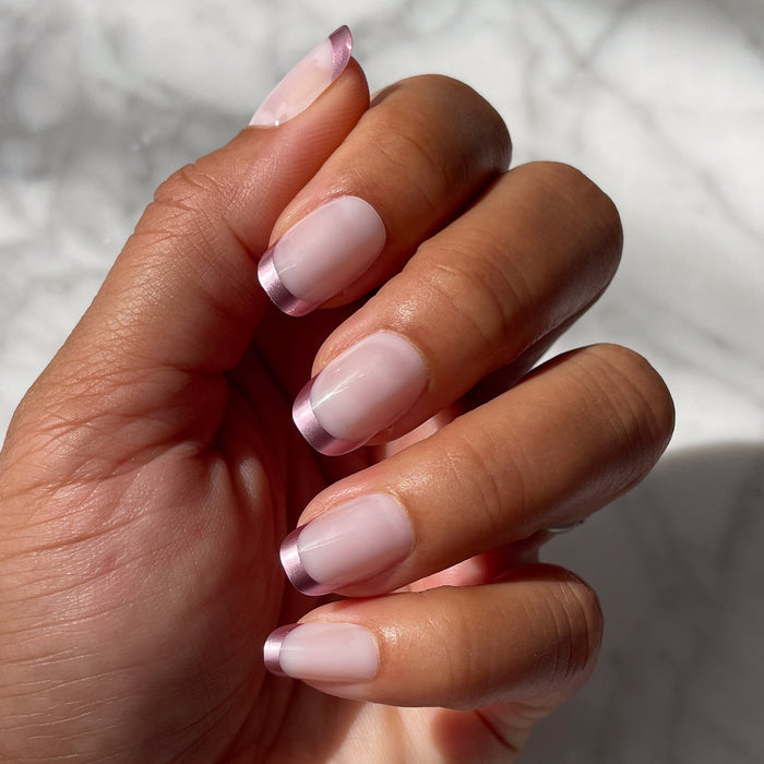 Metallic Matte French - Press-On | Short | Squoval false nails with glossy metallic pink tips and matte base on natural hand