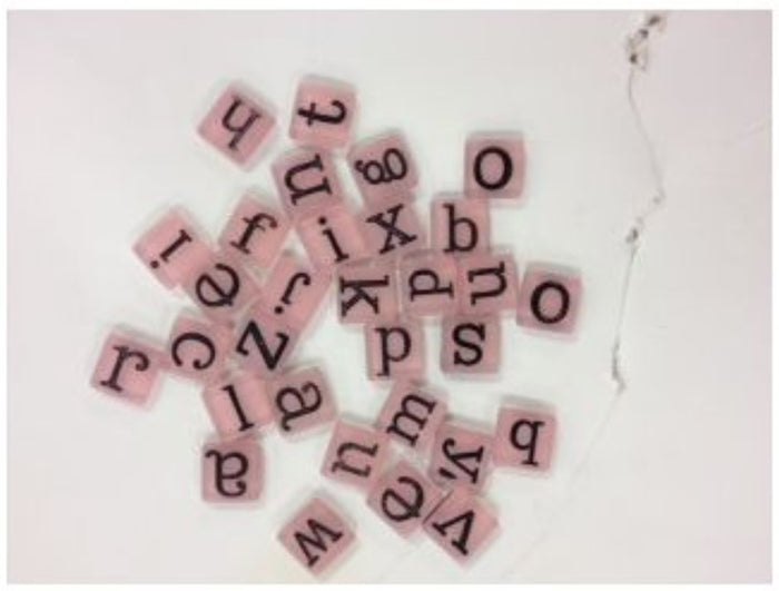 Scrapbook embellishment that measures 3/8" Alphabet Square Disc A-Z. There are 31 pieces in each package. Available at embellishaway.ca in Bowmanville Ontario Canada.