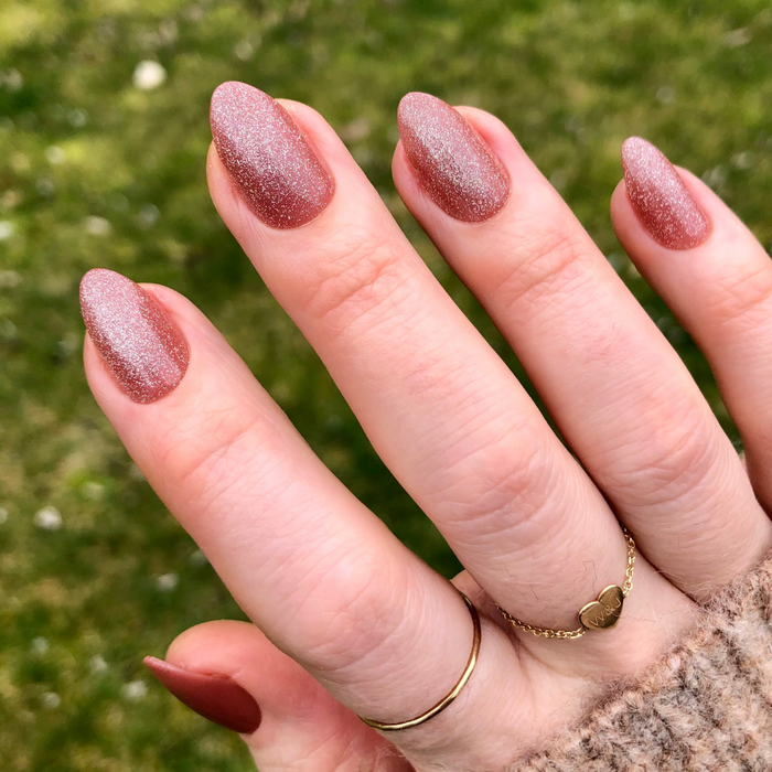Neutral Velvet - Press-On | Medium | Almond showing hand with medium almond press-on nails in brown velvet cateye polish outdoors