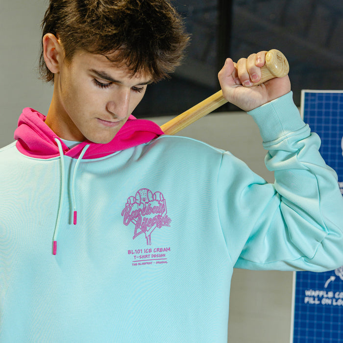 Person wearing light blue hoodie with pink hood and pink BL101 Ice cream logo