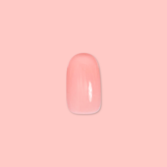 Pen Pal - Press-On | Short | Round showing single short round false nail in bubblegum pink on soft pink background