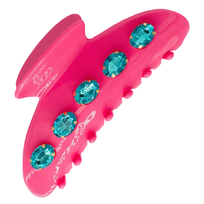 Pink hair clip with blue gemstones on a white background