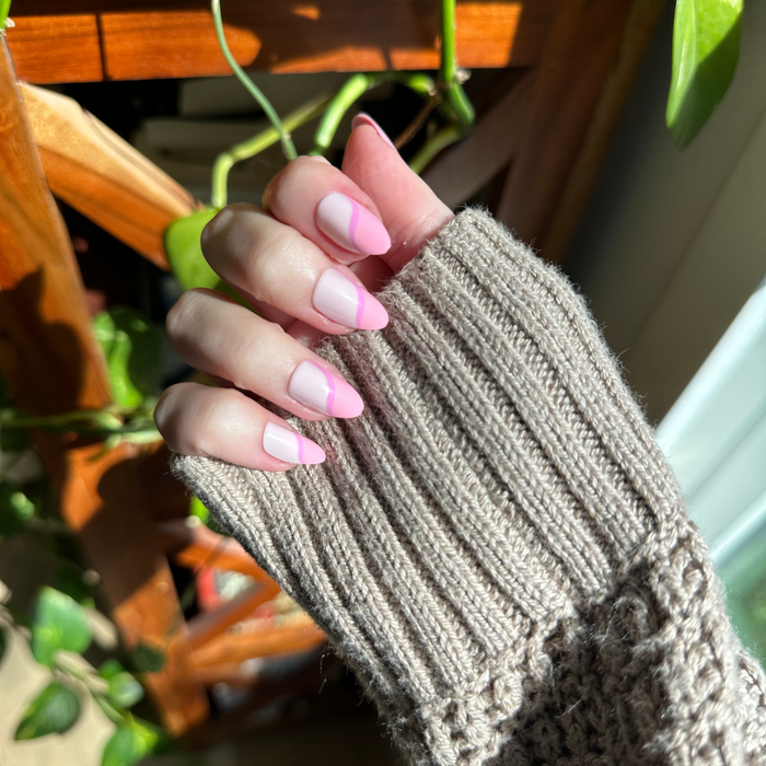 Pink Simple Twist - Press-On | Medium | Almond false nails with soft pink tones and subtle twist design for at-home mani