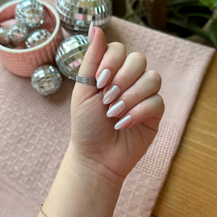 Purple Puka - Press-On | Medium | Almond showing iridescent lavender medium almond false nails on hand indoors with silver ring