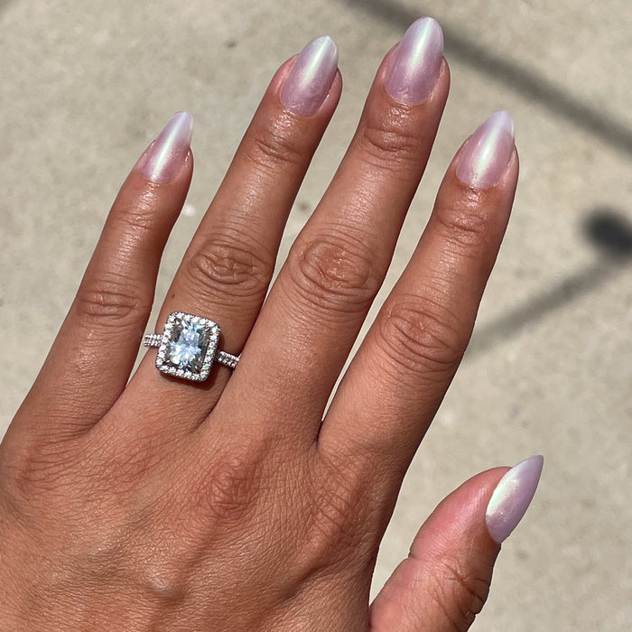 Purple Puka - Press-On | Medium | Oval showing iridescent lavender medium oval false nails on hand for an easy mani