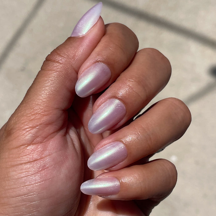 Purple Puka - Press-On | Medium | Oval showing iridescent lavender medium oval false nails on hand in natural light