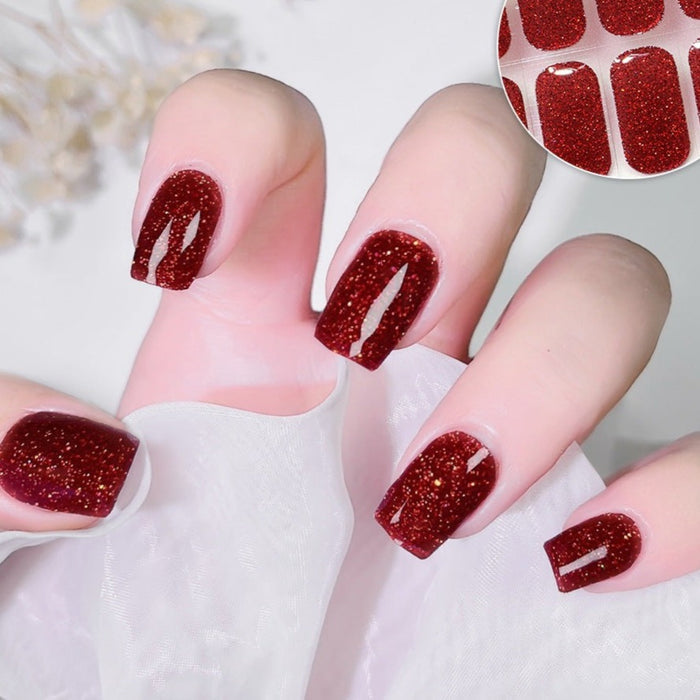 Ruby Fire Gel Nail Strips on Hand - Red Glitter Semicured UV Nail Stickers
