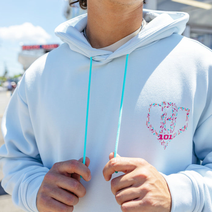 Adult model wearing hoodie with "Safe N Sweet" design