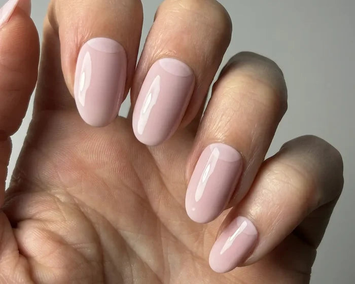 Ballet Blush semi-cured gel nail wraps worn on a hand