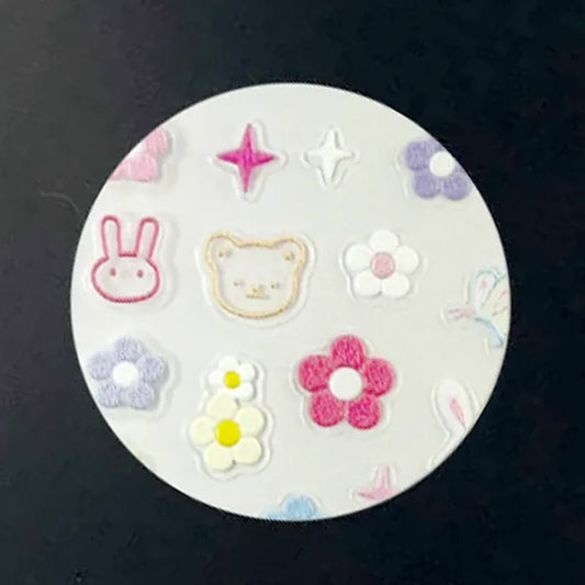 Spring Meadow nail decal sheet with pastel daisies, bunnies and butterflies