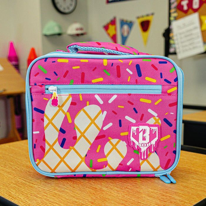 Adult model wearing pink lunch box with "Strawberry Ice Cream  SZN 2" design