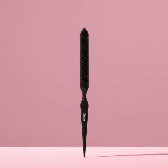 black L’ange teasing brush standing upright on pink background