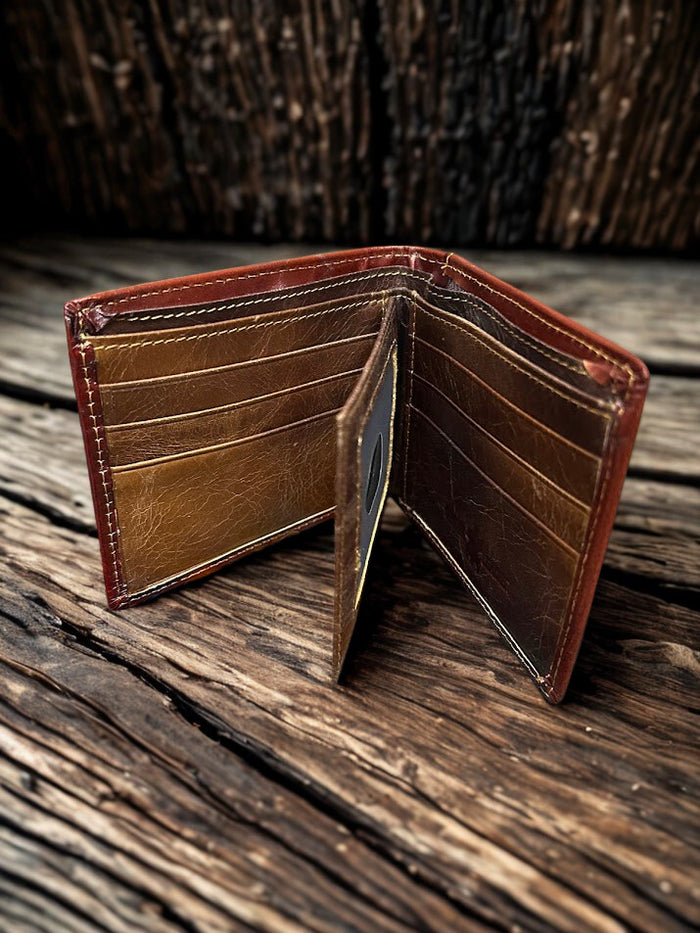 This Brown tooled leather bifold wallet.  Inside view showing multiple card slots and a dual ID window.