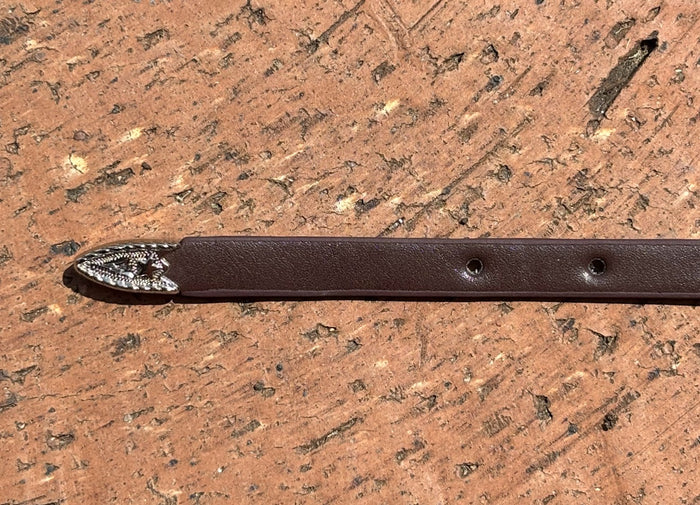 Coffee Brown leather hat band with Horse Head Concho and silver bands separating Conchos. Close up view of end.