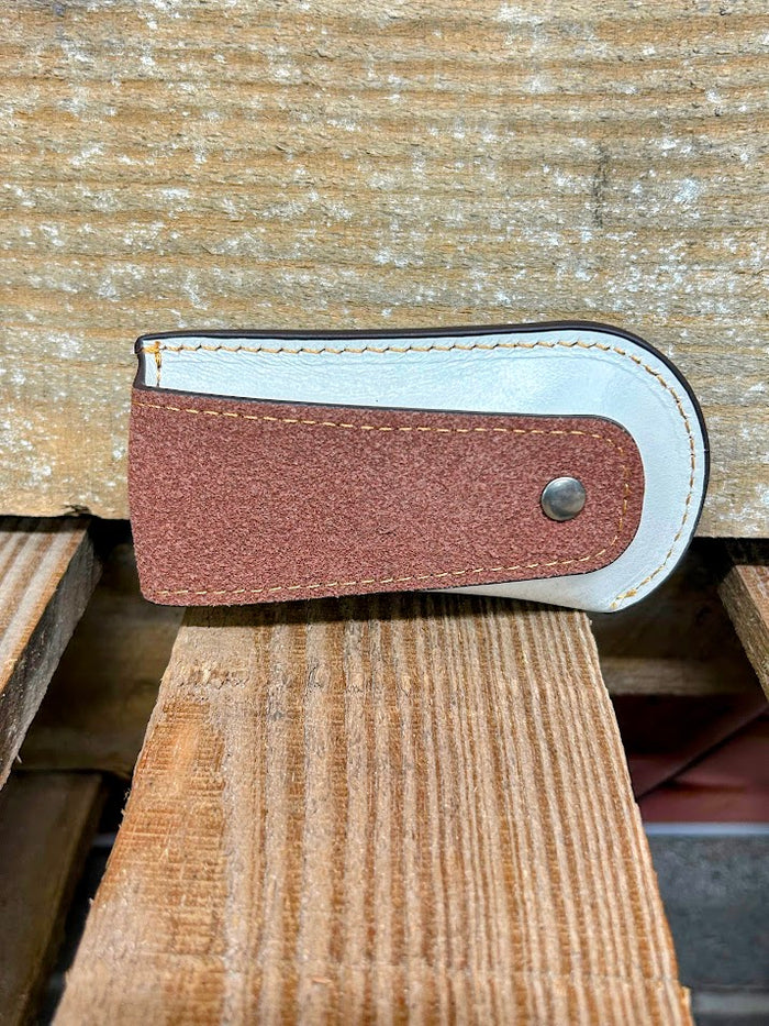 Beige tooled leather knife sheath. Rear view showing leather belt loop.