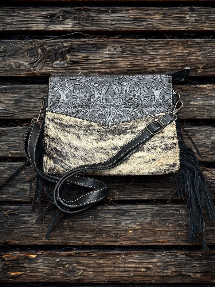 This Black tooled leather and cowhide purse features a removable adjustable shoulder strap and zippered close concealed carry pocket on the rear. Front View C