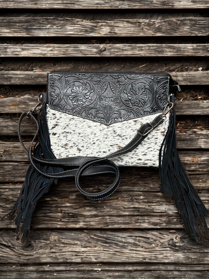 This Black tooled leather and cowhide purse features a removable adjustable shoulder strap and zippered close concealed carry pocket on the rear. Front View D