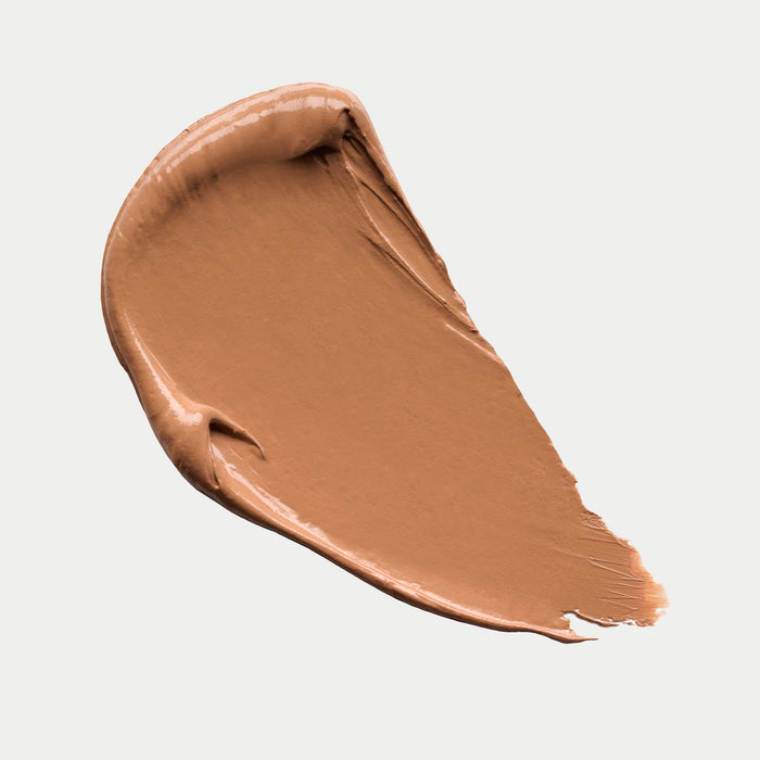 Brown makeup swatch on a light gray background