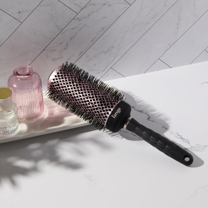 Round brush on vanity.