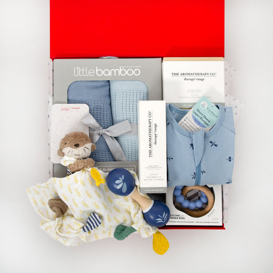 Includes a blueberry Bamboo Cellular Blanket Set containing two super soft, lightweight blankets. An ergoPouch romper, a Speedy Monkey Wooden Maraca, Jellystone Moon Teething Ring and cute Fehn muslin comfort toy. For mum, a Coconut & Waterflower scented candle and matching hand cream. Price: $230