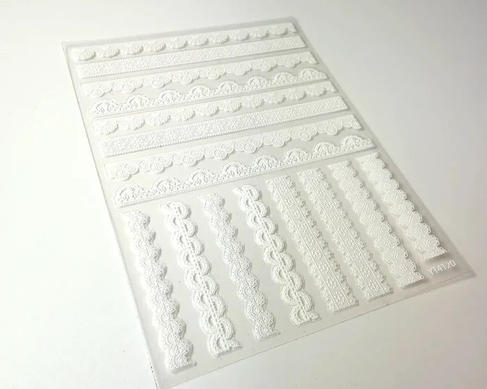 White Lace Trim nail art decals, angled close-up