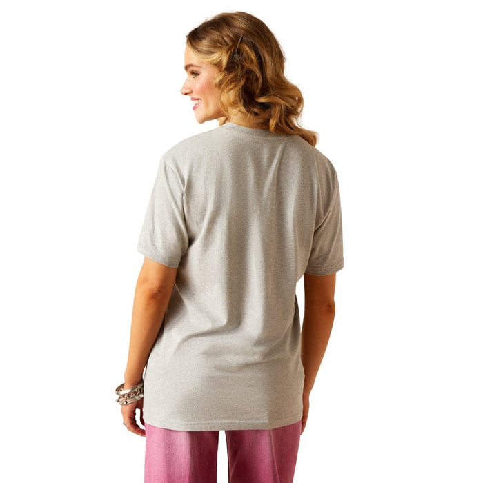 Women's Ariat Boyfriend fit Arrowhead graphic print T-Shirt in Heather Grey. This shirt features a graphic print on the front of a cow in the shape of an arrowhead with the Ariat logo. Rear view showing shirt untucked.