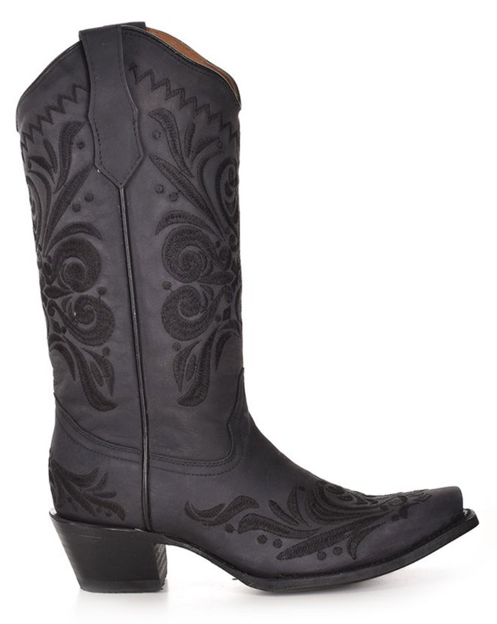 Side view of  black snip toe western boot with embroidery stitching details.