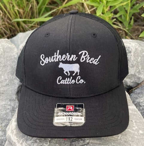 A black youth snapback cap with 'Southern Bred Cattle Co.' text and a cow silhouette on the front.
